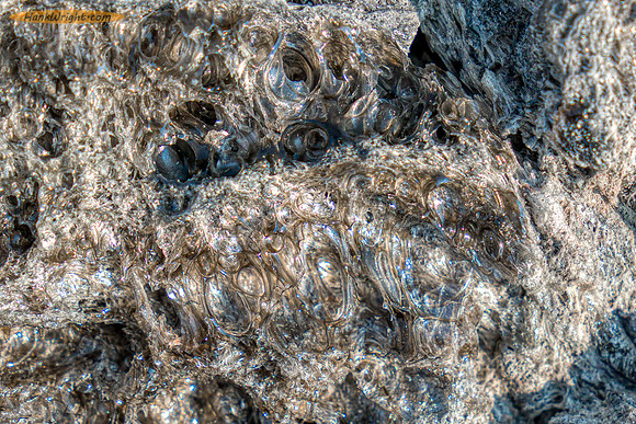 Close up of the glass with volcanic gas bubbles