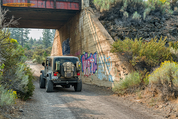 Going under train trestle on Military Road