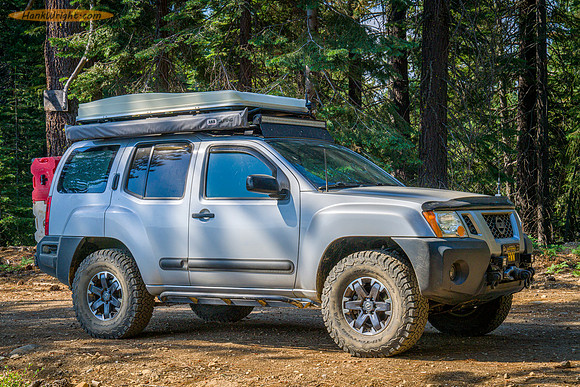 Xterra traveling through forest